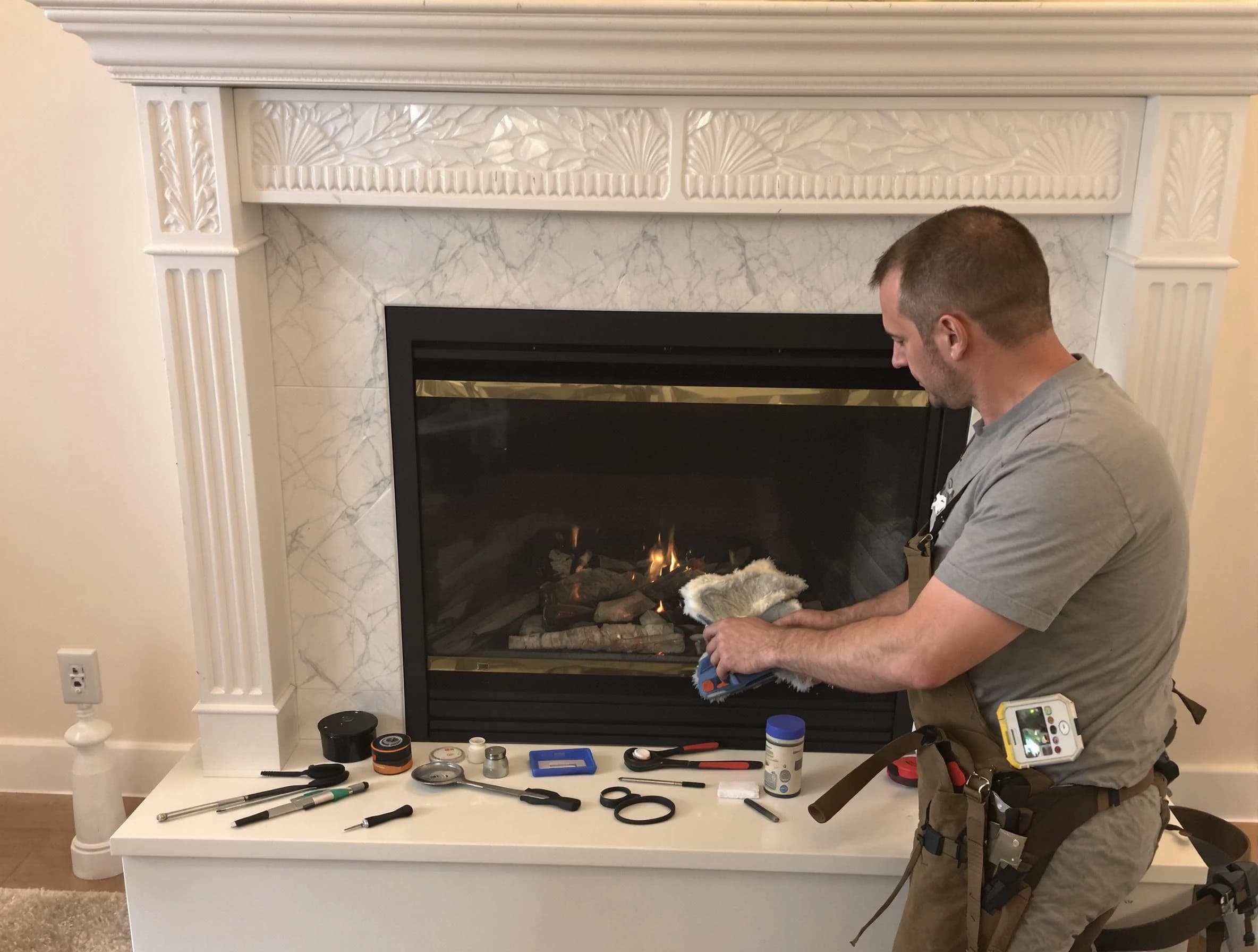 Arvada Chimney Sweep performing fireplace maintenance in Arvada, CO